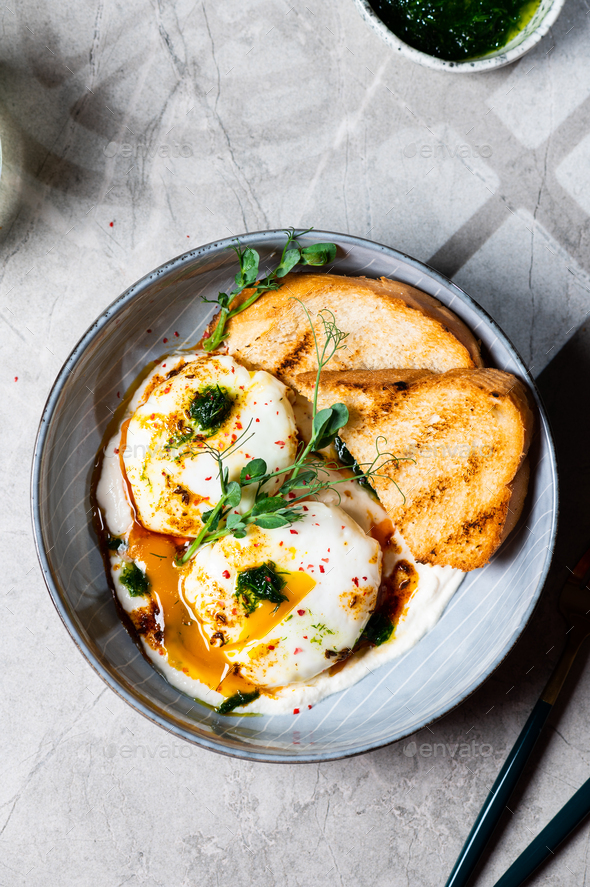 Cilbir or Turkish Eggs. mezze: poached eggs topped over herbed greek ...